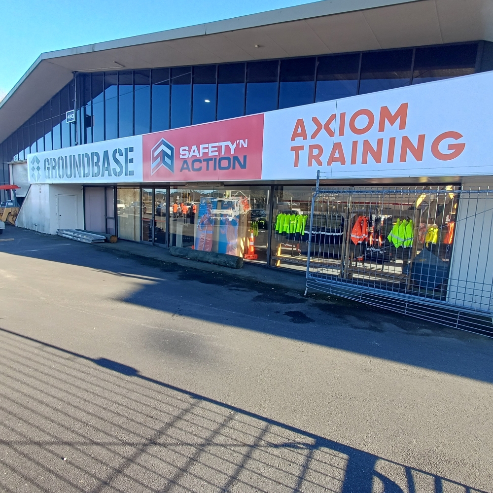 New Safety ‘n Action and Axiom Training centre in Rotorua, with signage and hi-vis gear in front windows.