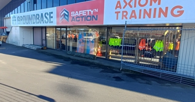 New Safety ‘n Action and Axiom Training centre in Rotorua, with signage and hi-vis gear in front windows.