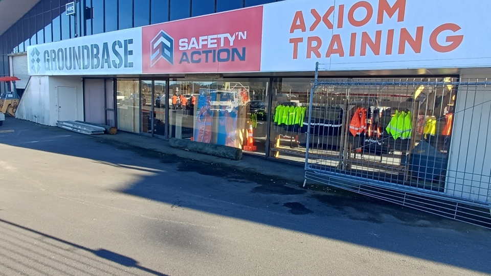 New Safety ‘n Action and Axiom Training centre in Rotorua, with signage and hi-vis gear in front windows.