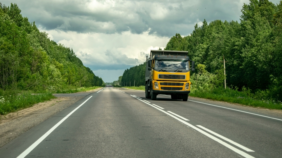 Class 4 truck driving on a New Zealand highway, suitable for heavy vehicle licence training